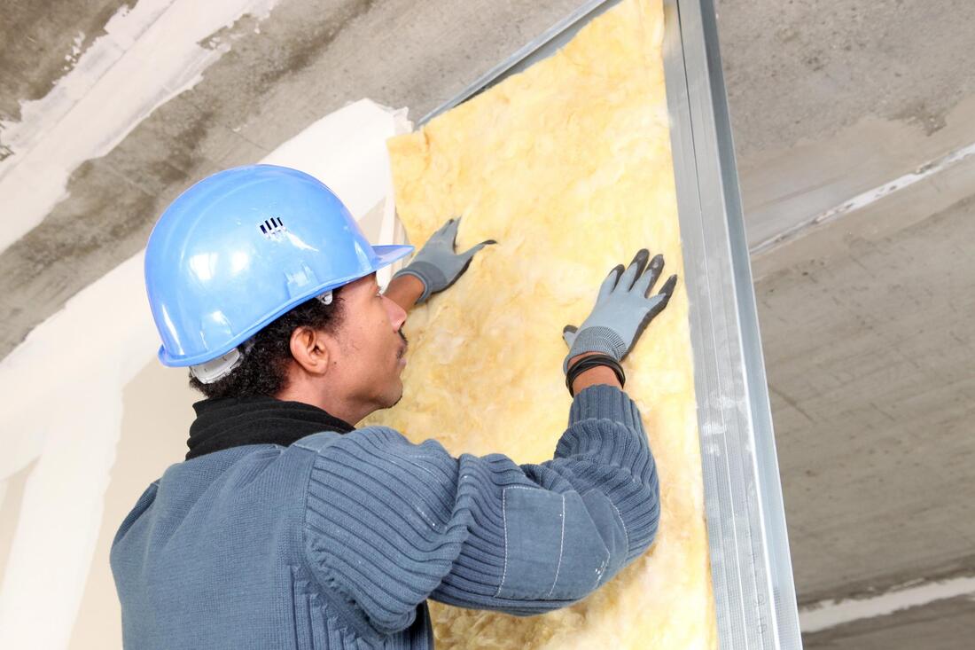 professional drywall contractors working on insulation 